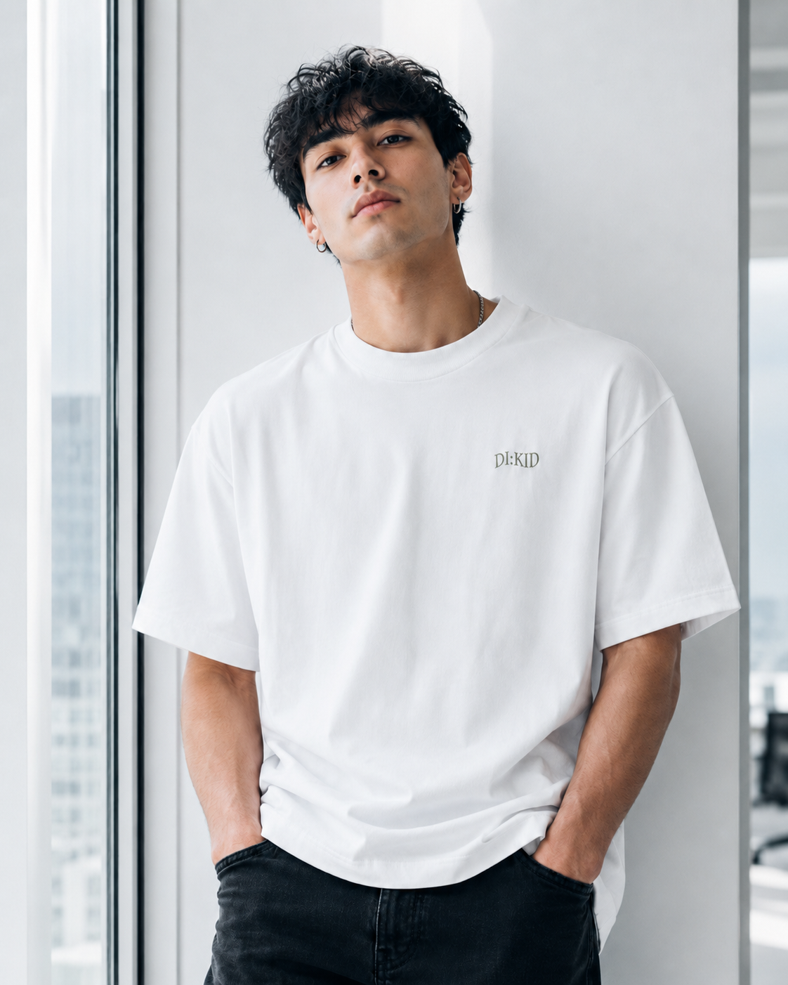 Model wearing the white DI:KID tee