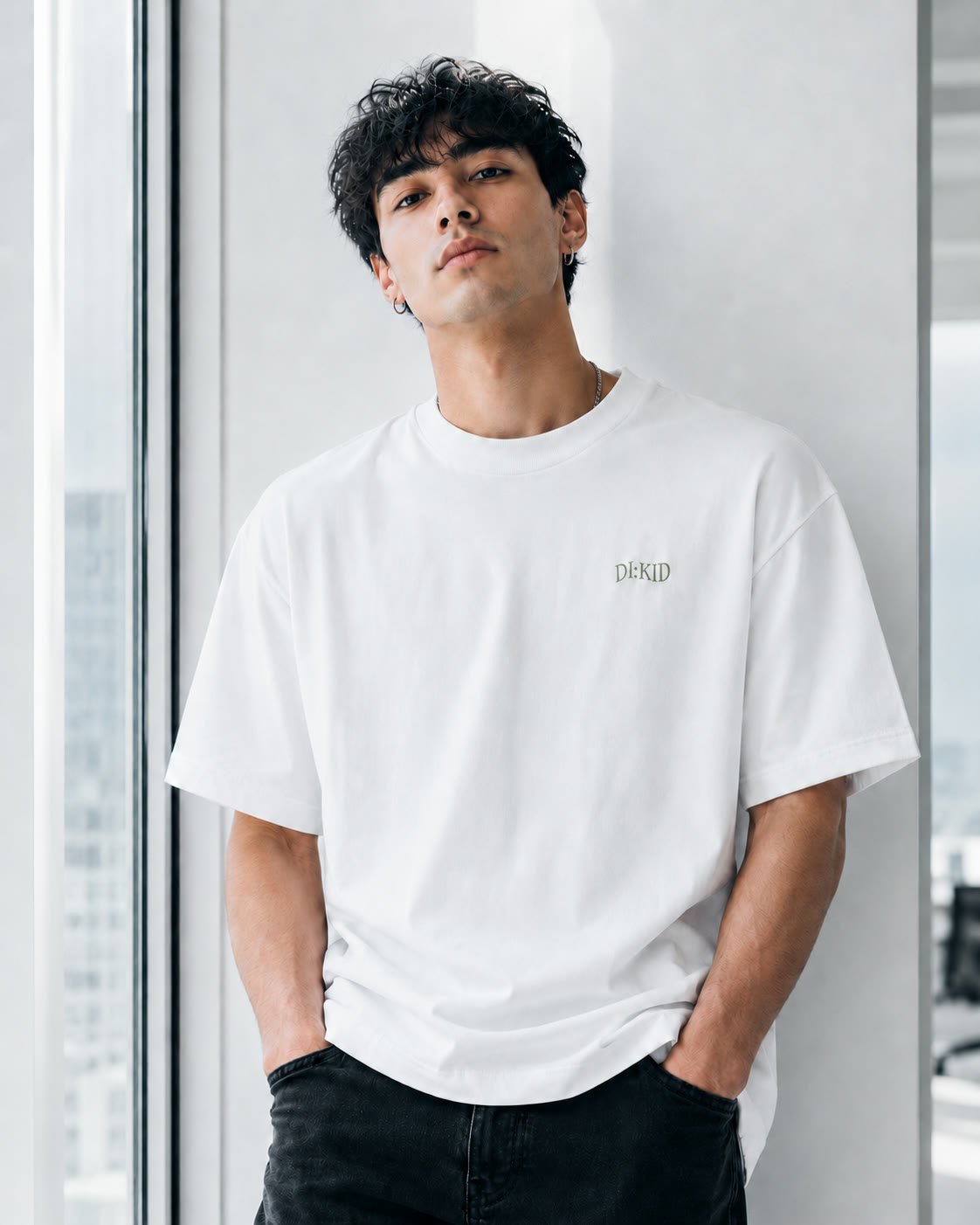 Model in the white tee, front chest print