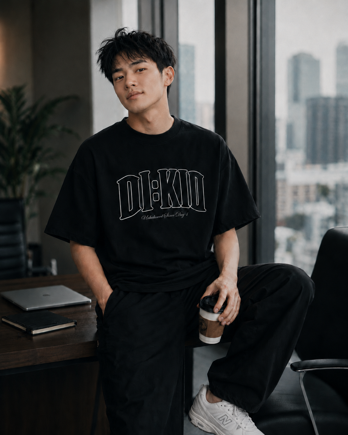 Model wearing the black Unbothered Since Day 1 tee