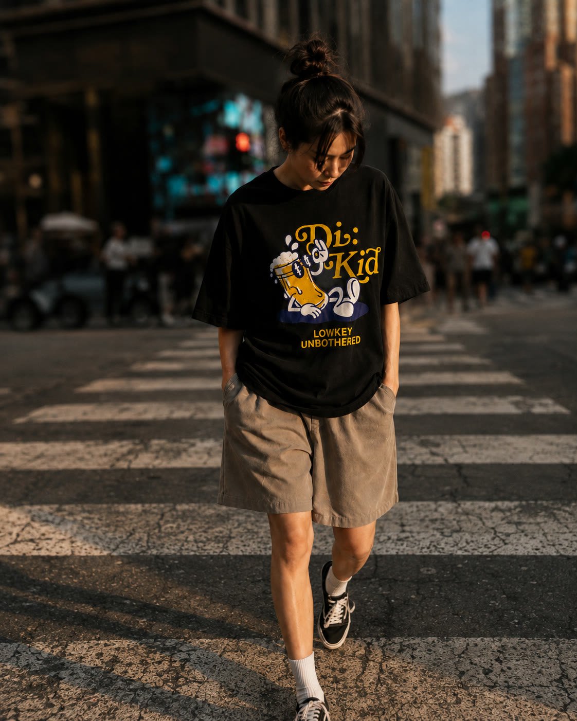 Model crossing the street in the Lowkey Unbothered tee